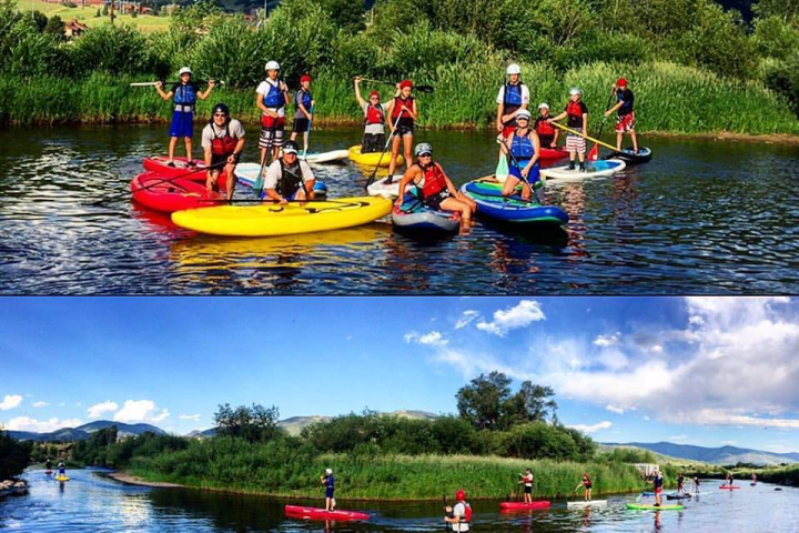 a group of people in a small boat in a body of water